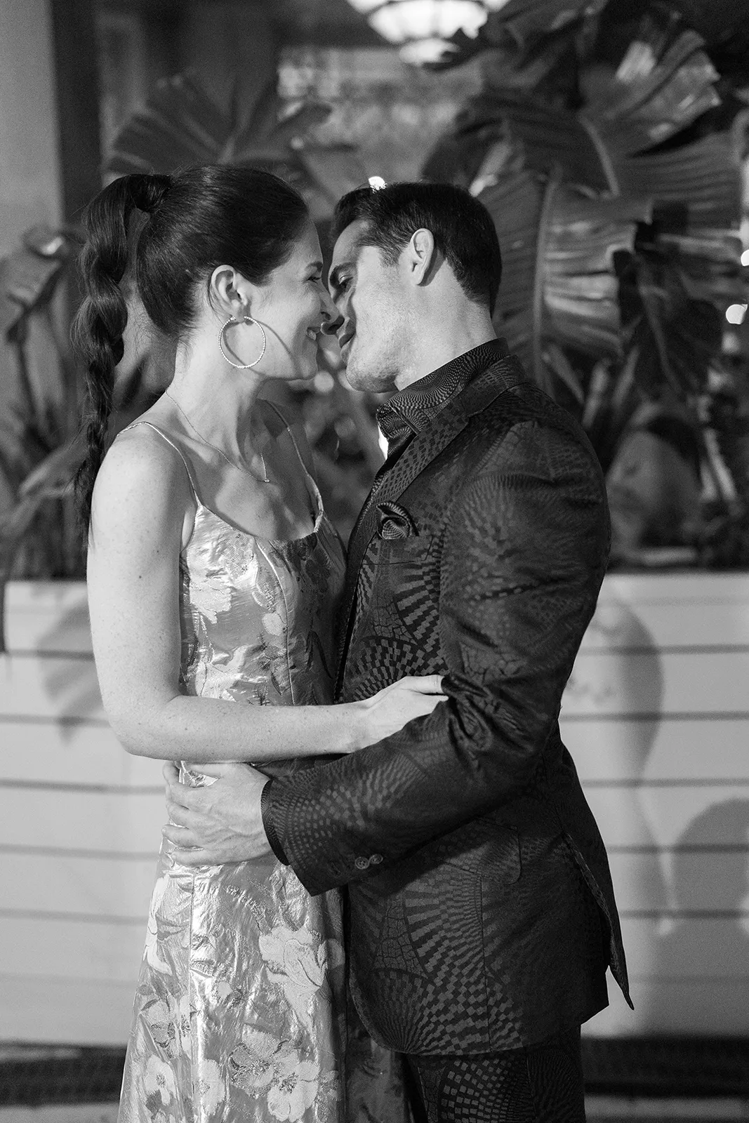 Couple sharing a quiet, intimate moment during their rehearsal dinner at Hasalon Miami Beach