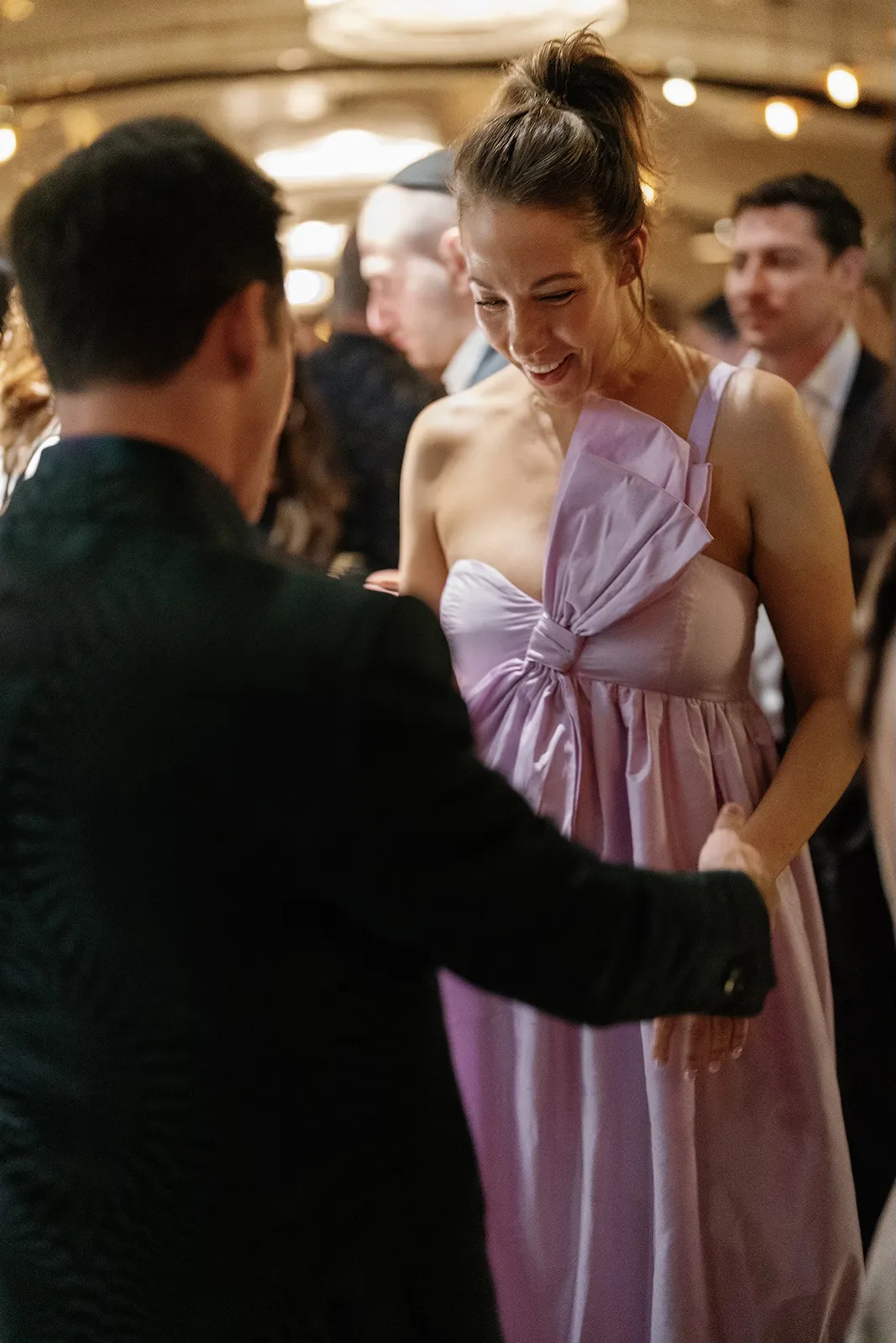 Guest laughing and dancing during the rehearsal dinner party at Hasalon Miami Beach