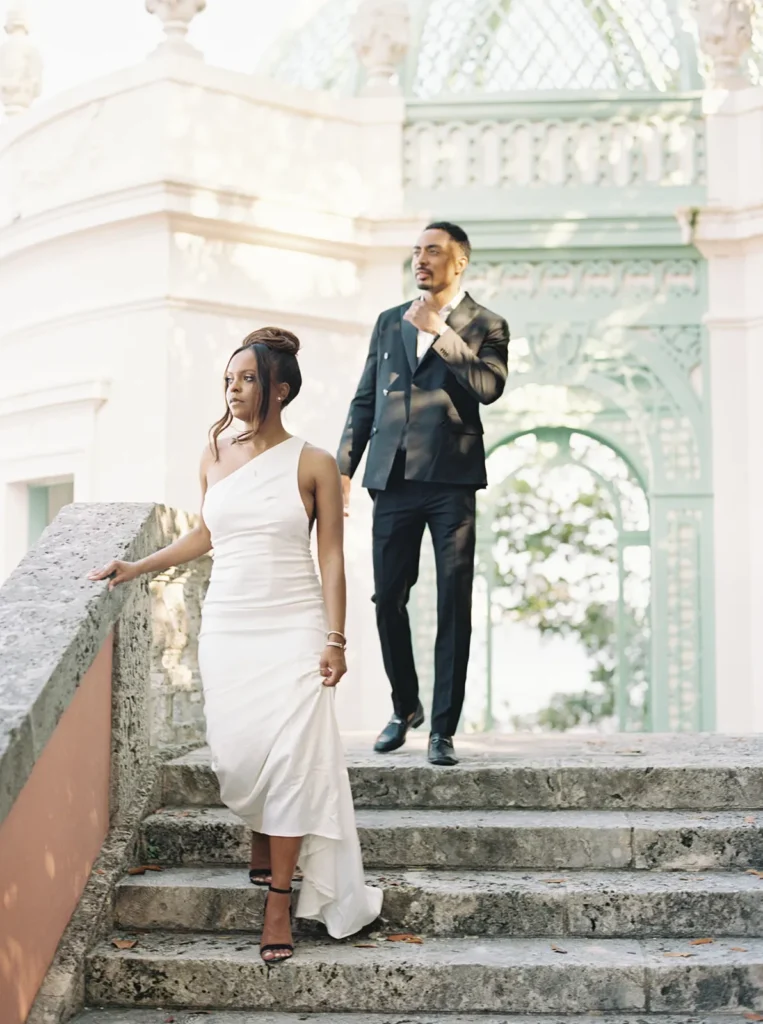 couple walking down the stairs exiting the tea house in vizcaya museum