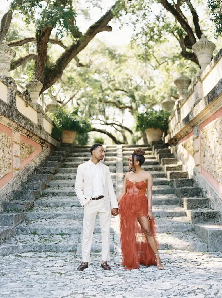 couple in front of iconic stairs in Vizcaya Museum