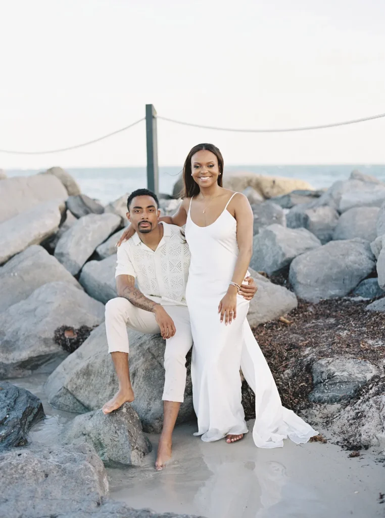 couple near rocks in bill baggs state park during their engagement session