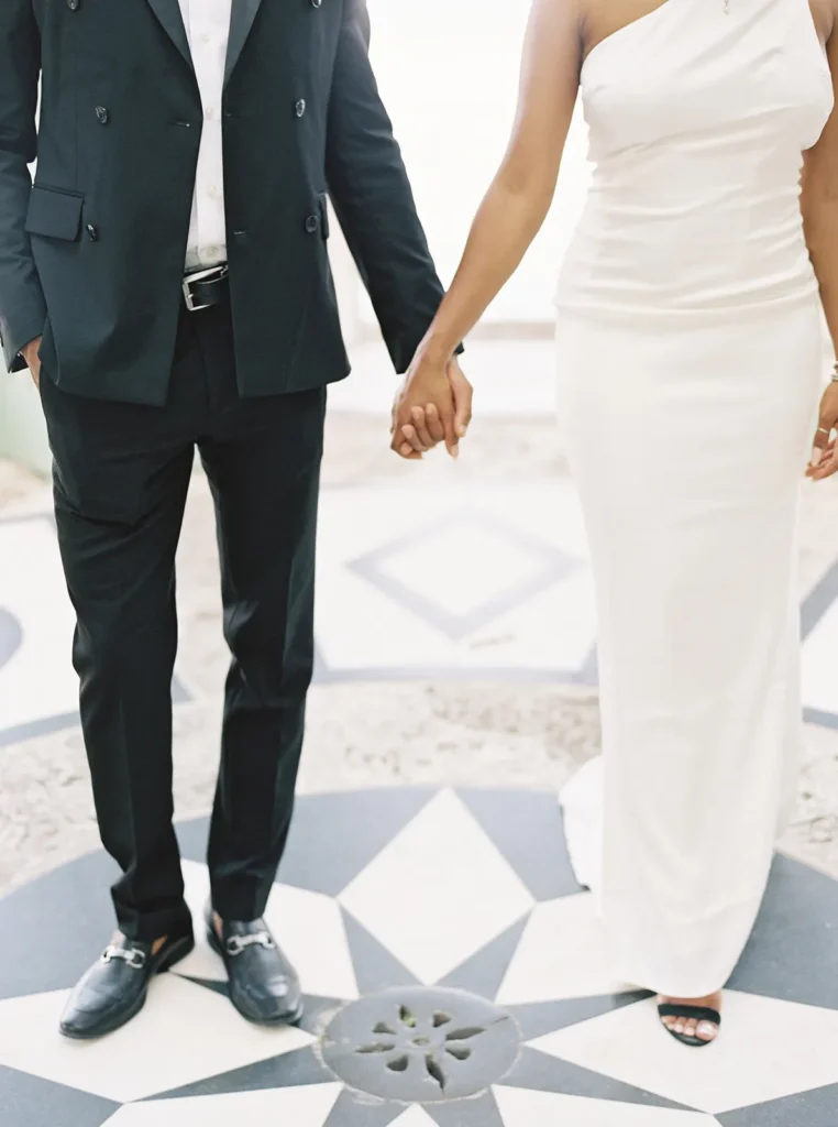 couple holding hands as they walk in vizcaya museum
