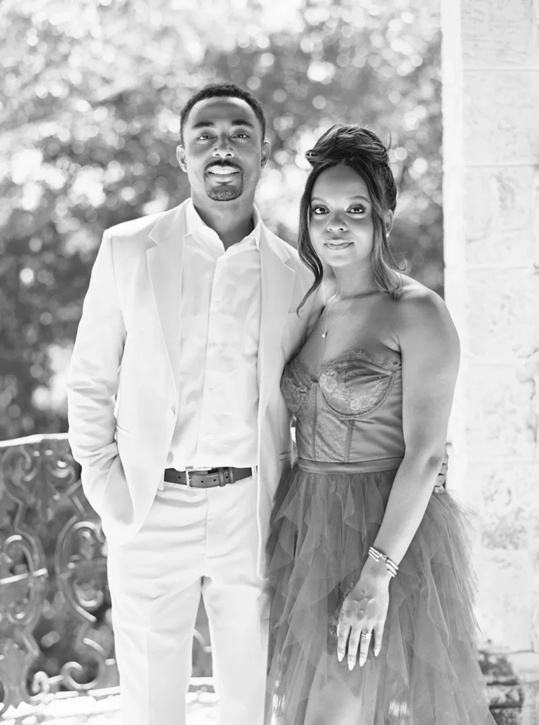couple smiling for the camera in a traditional couple portrait