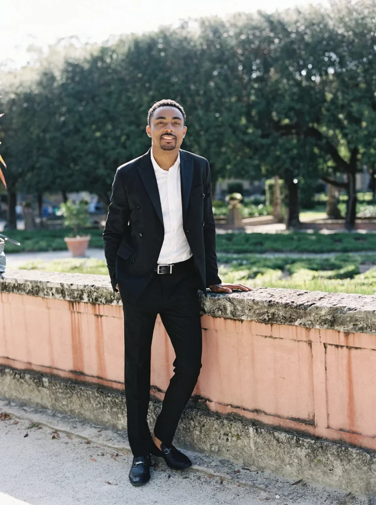 groom smiling leaning on a bench in vizcaya