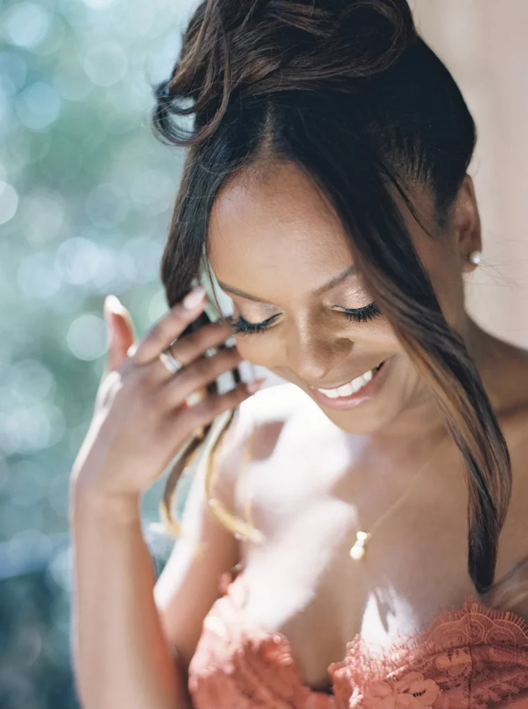 bride looking down as the sun softly hits her face