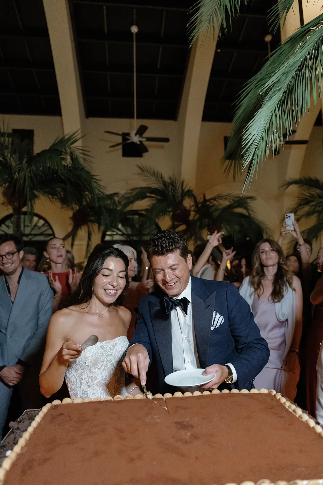 bride and groom cutting their tiramisu cake