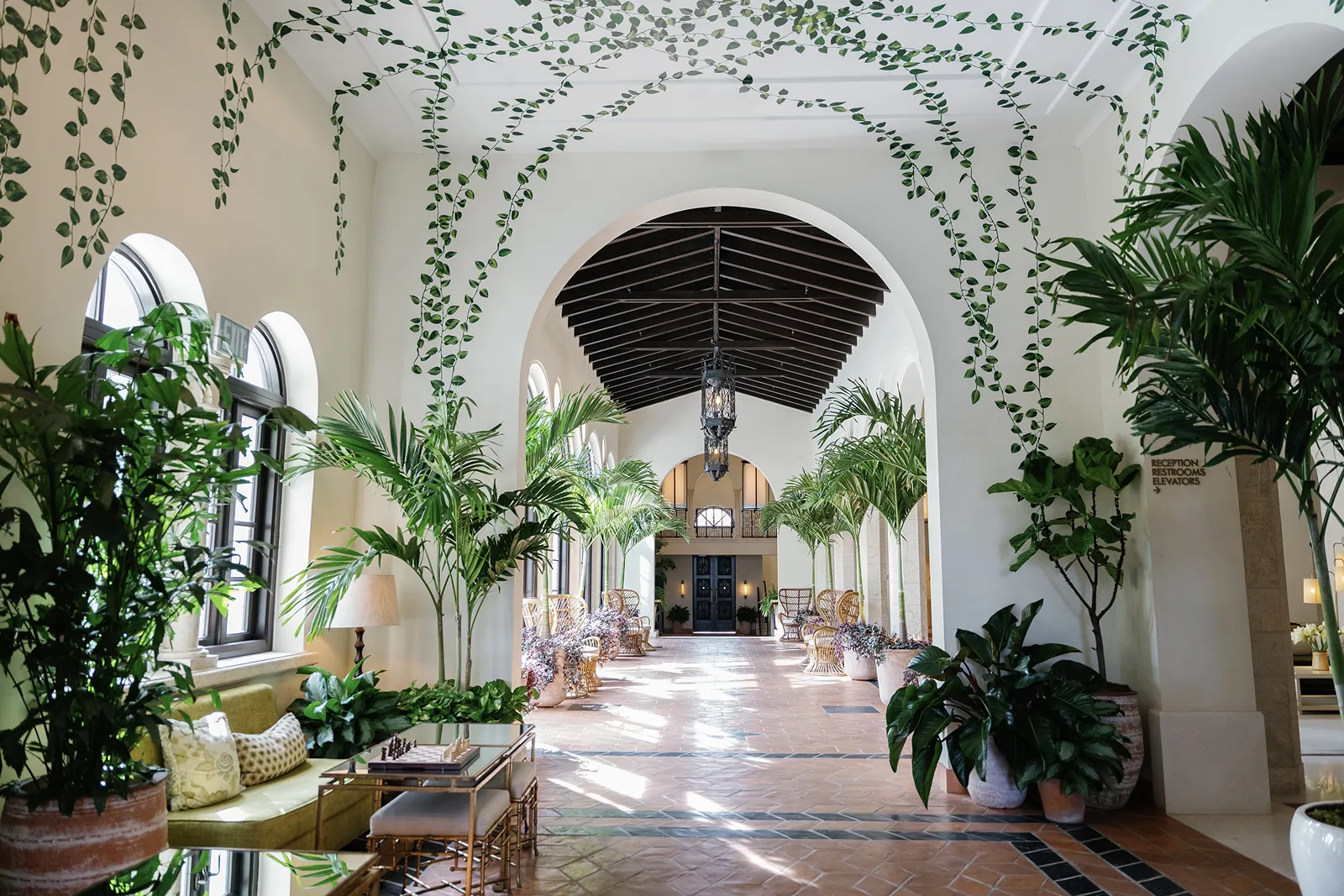 four seasons at the surf club hallway with painted green vine on walls