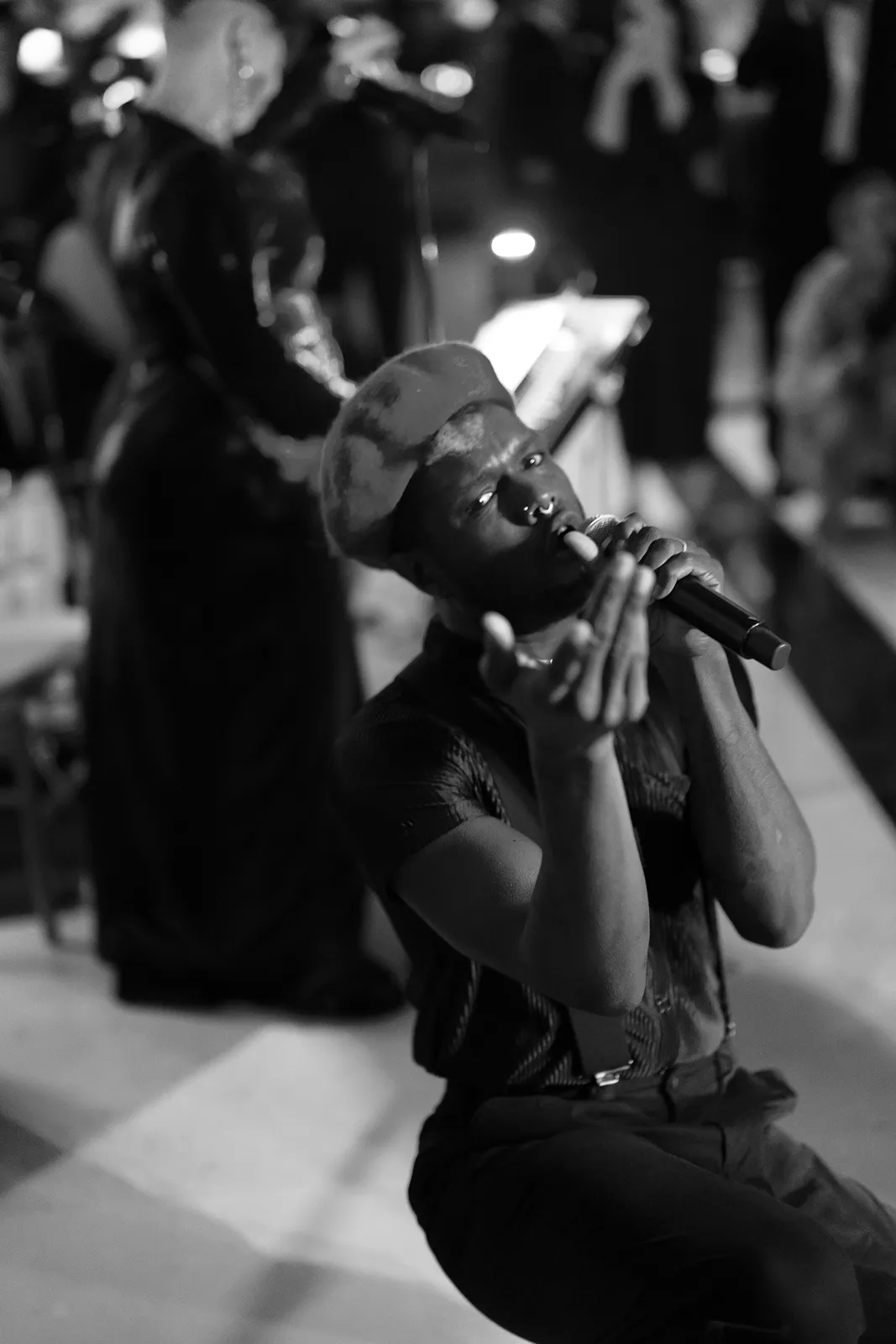 band singer singing into microphone during party