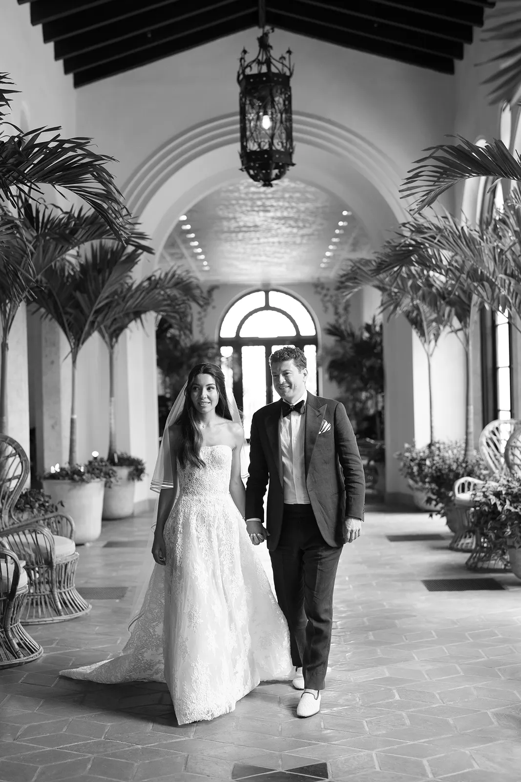 couple holding hands and talking during portraits