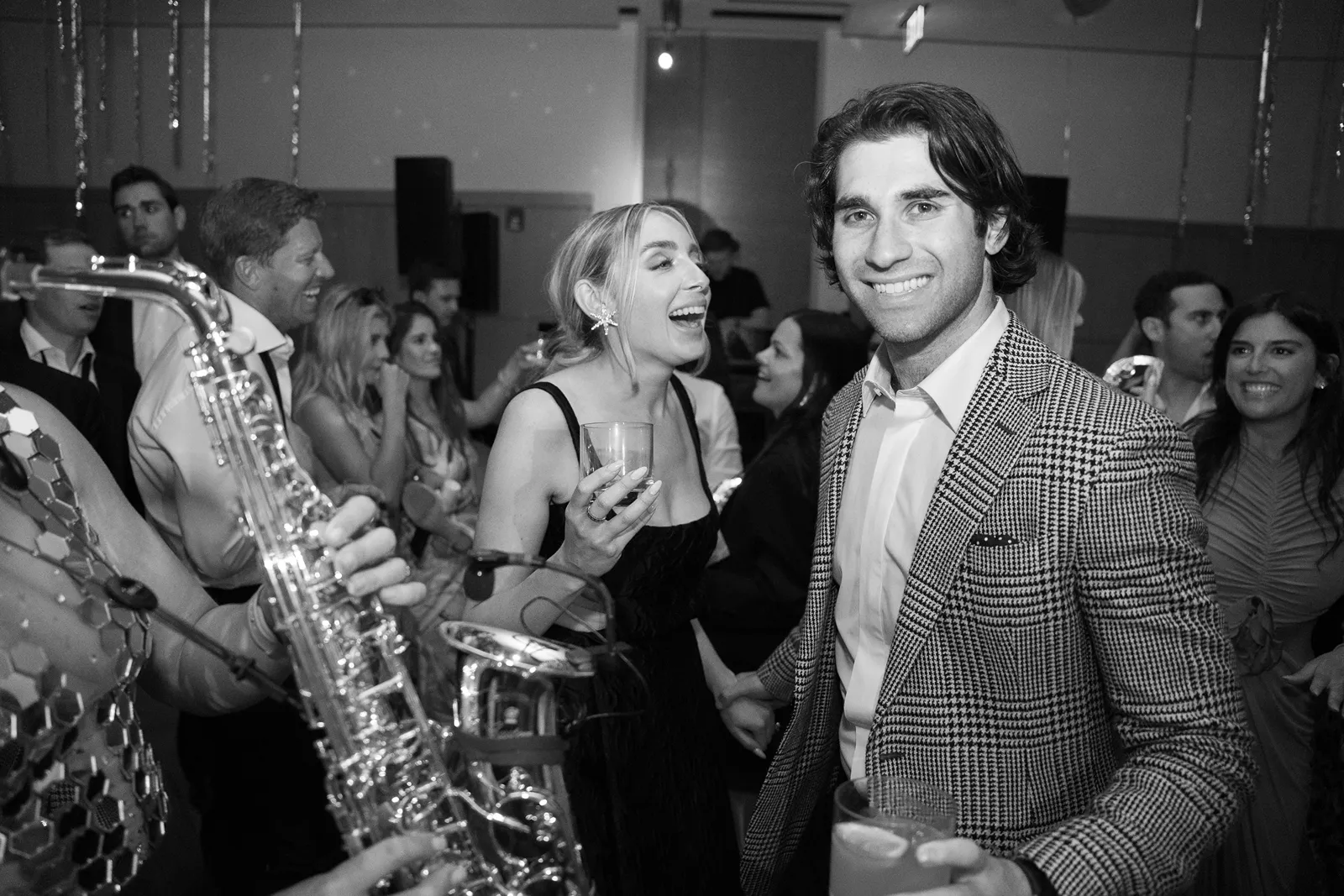 Black and white photo of couple dancing and laughing during a Montage Healdsburg wedding after party