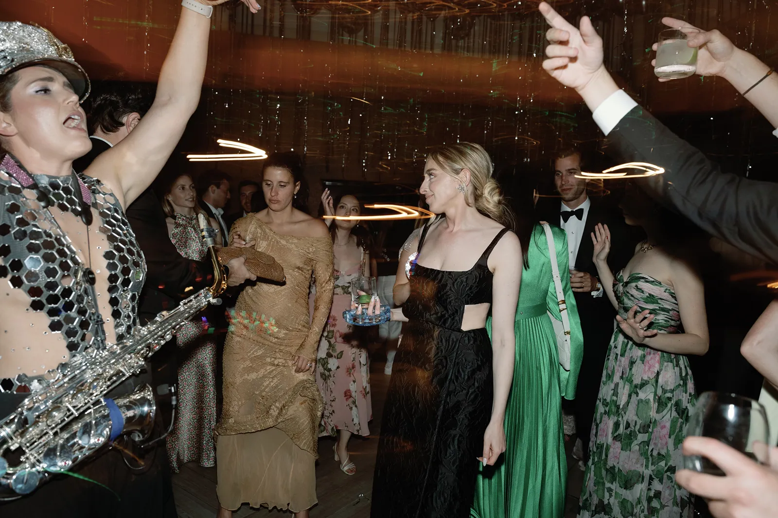 Wedding guests celebrating and dancing together during a high-energy after party with the bride
