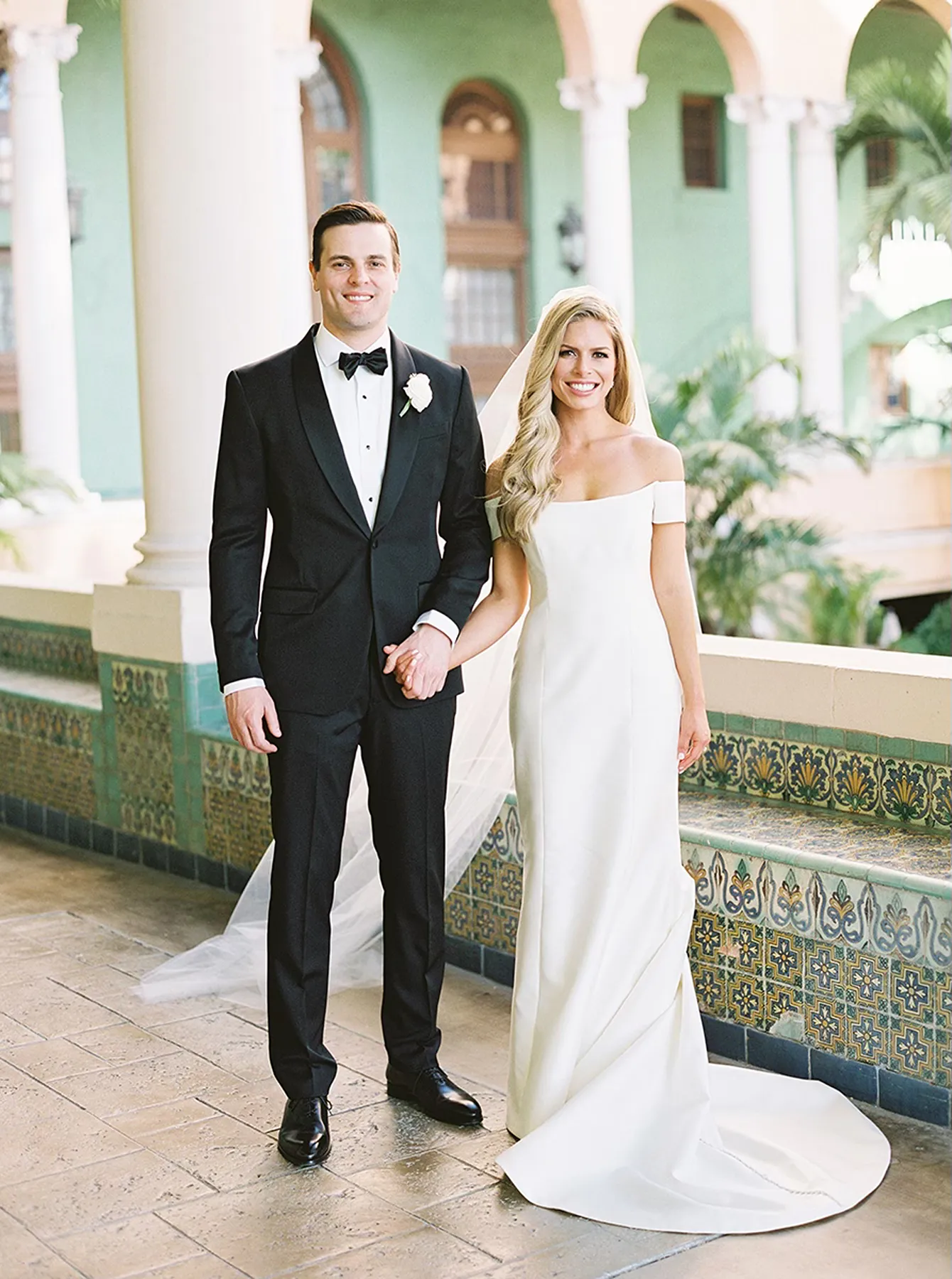 bride and groom holding hands during wedding portraits in the Biltmore hotel