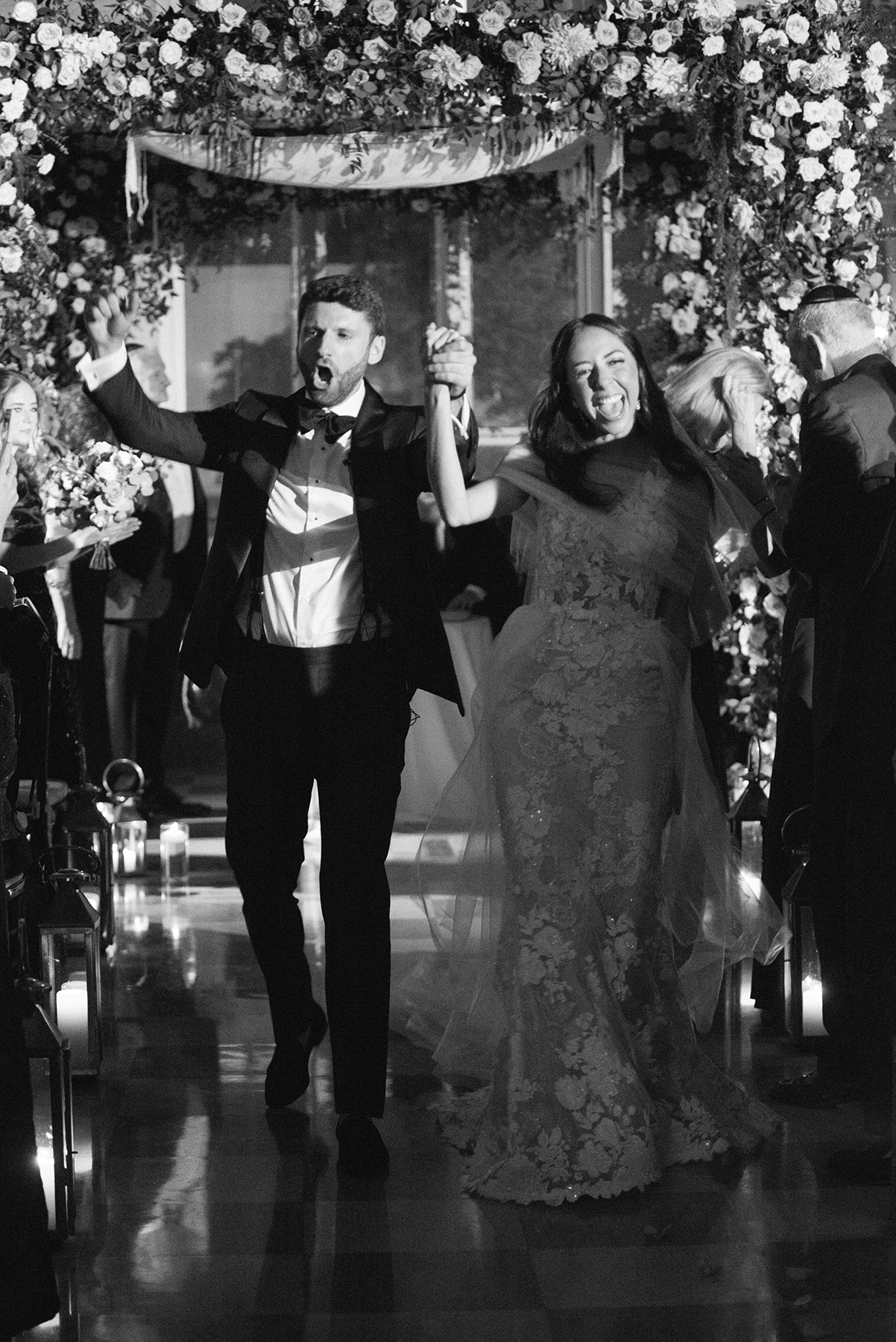 bride and groom cheering down the ceremony aisle in Dupont building
