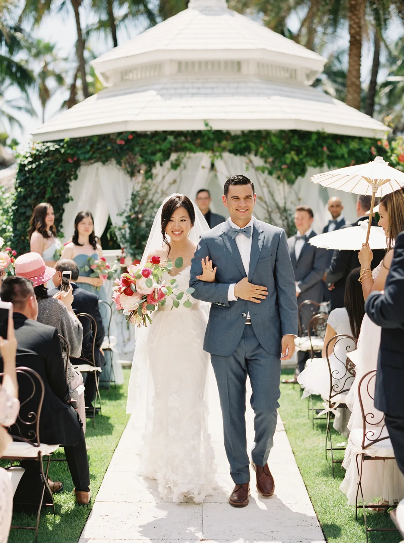 bride and groom walking down the aisle right after their I do's in a palms hotel wedding in Miami Beach