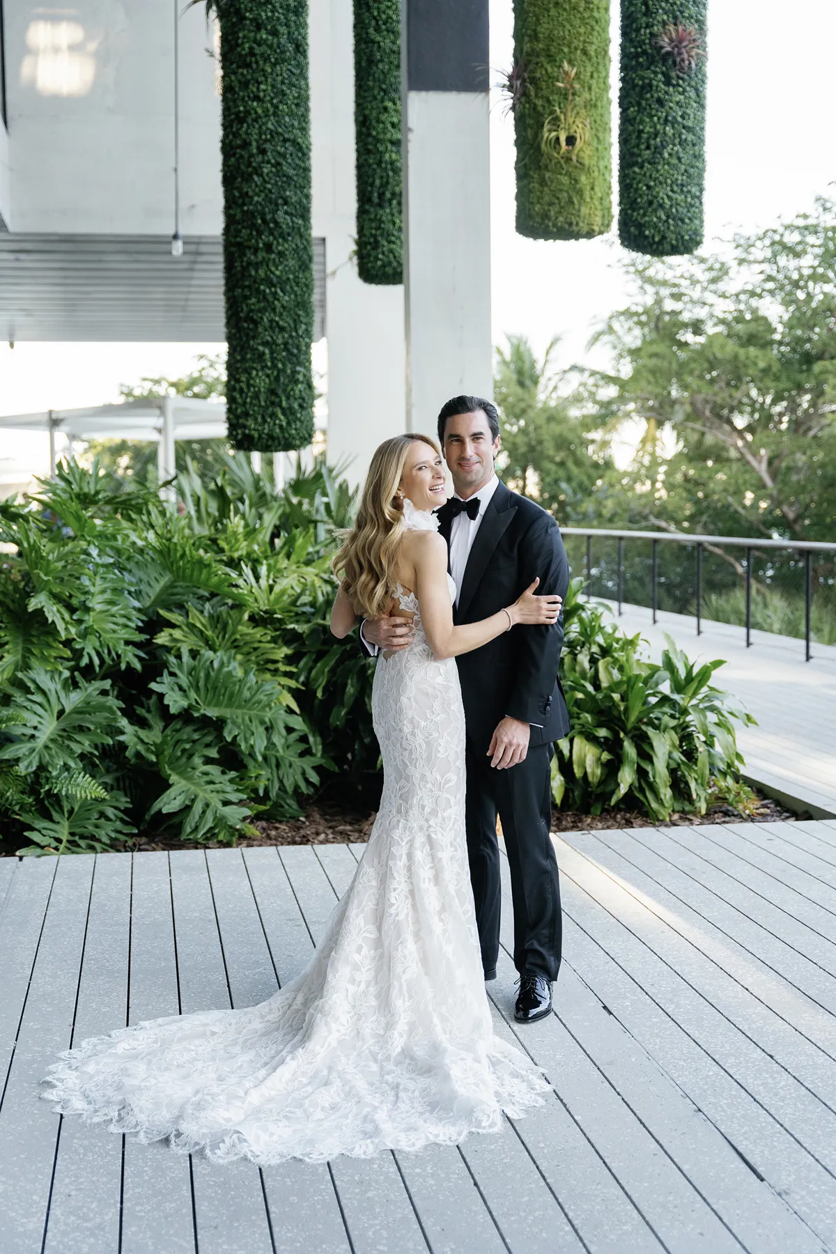 bride and groom hugging during portraits in a Perez art museum miami wedding