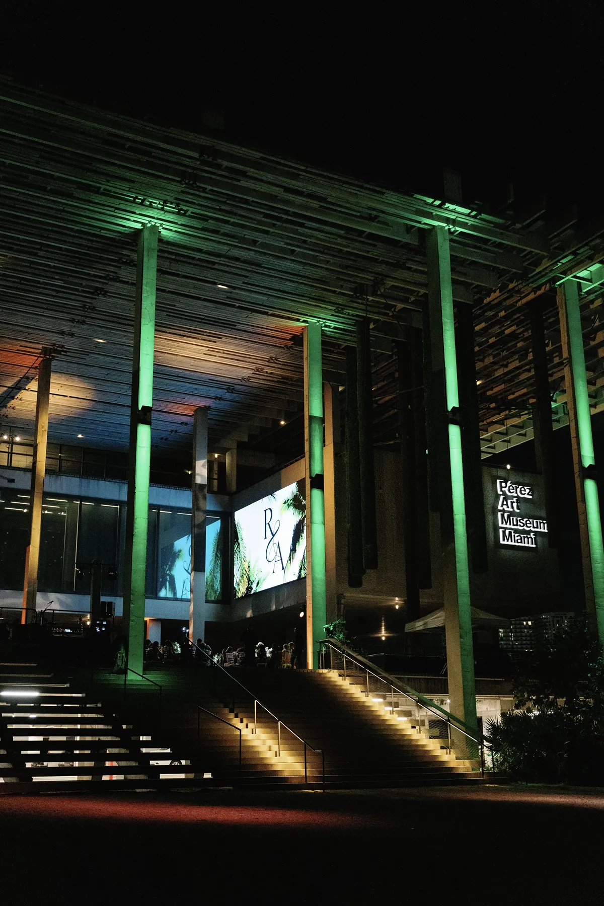 outdoor reception view with green neon lights during a PAMM wedding